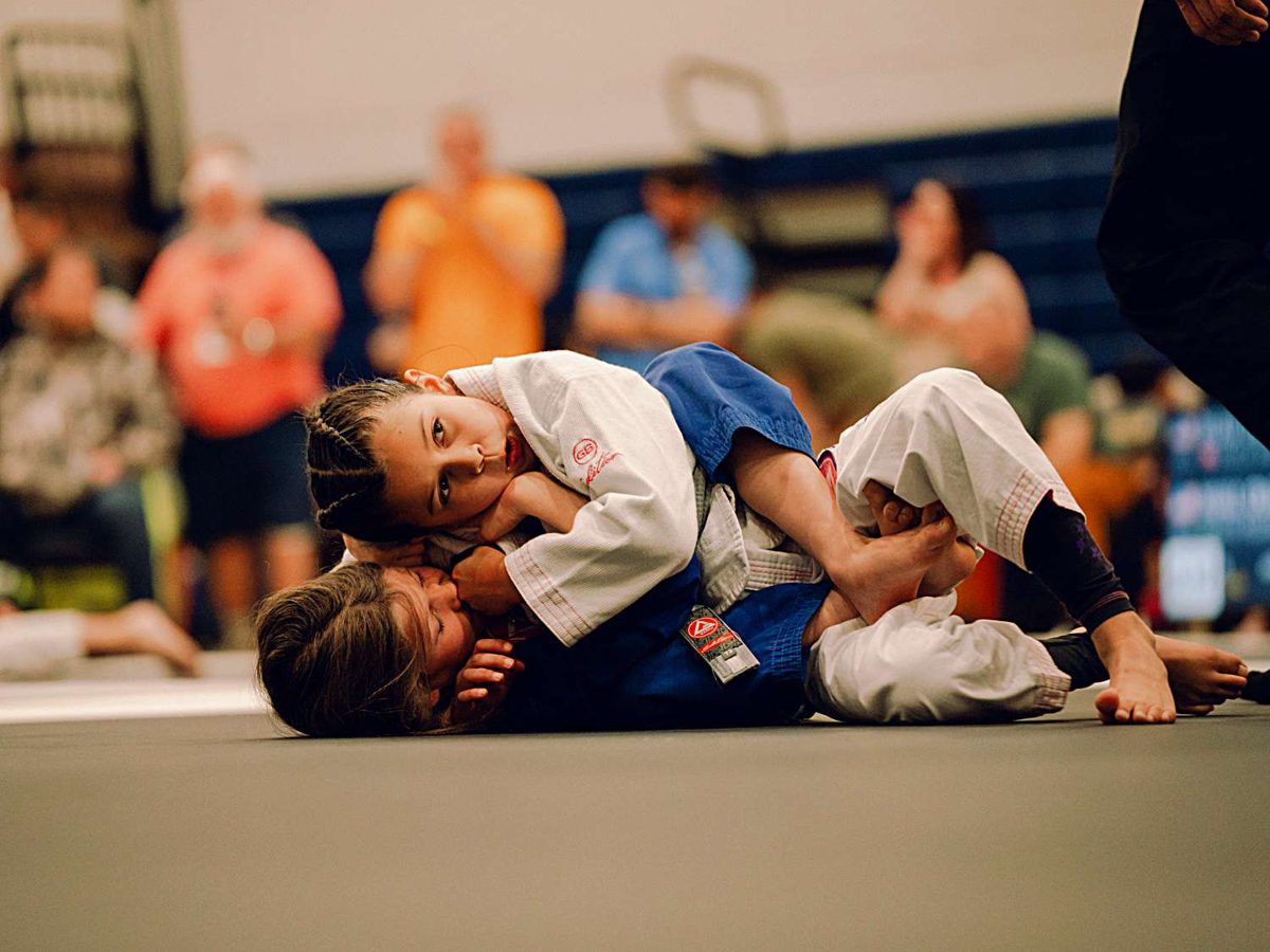 Close mat-side action with coaches cheering